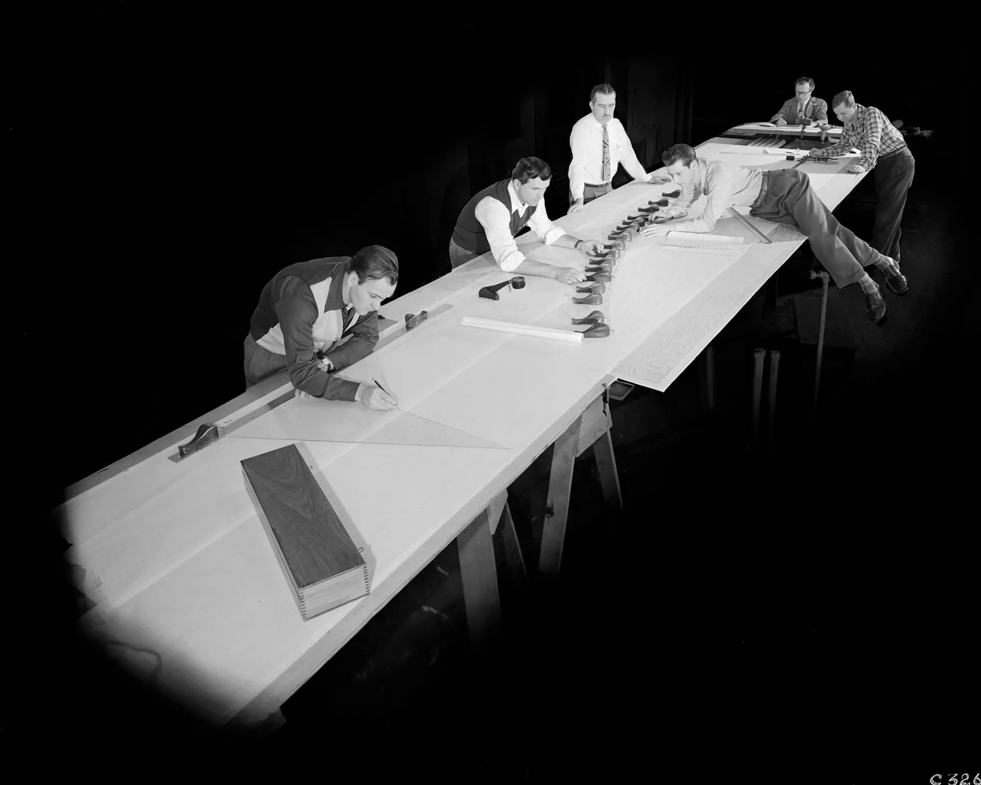 Draftsmen working on a blade template